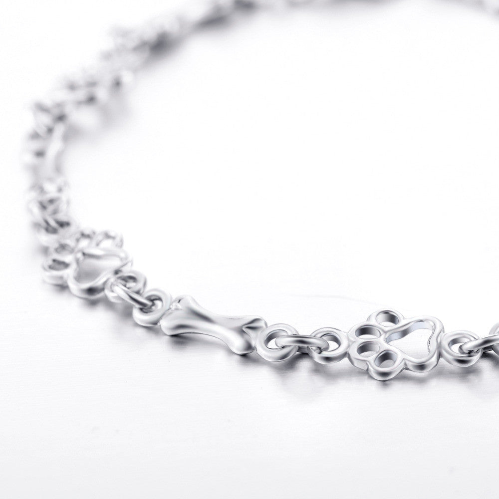 Pulsera con Charms de Huella de Perro y Hueso en Plata Pura, Edición Limitada
